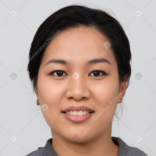 Joyful asian young-adult female with medium  black hair and brown eyes