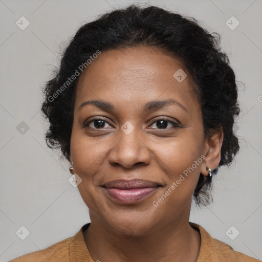 Joyful black adult female with medium  brown hair and brown eyes