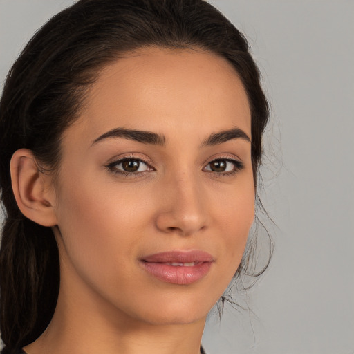 Joyful white young-adult female with long  brown hair and brown eyes