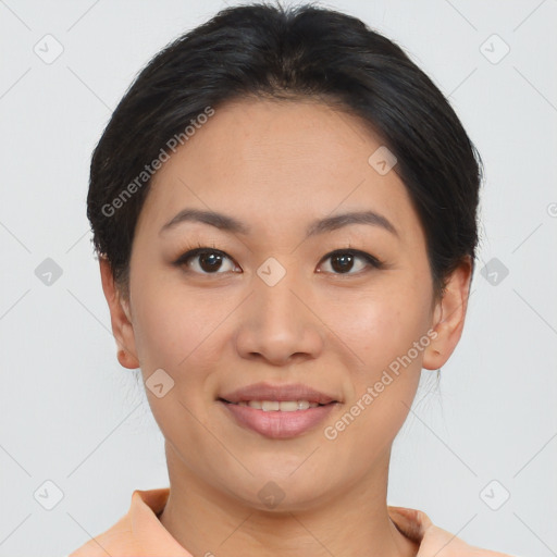 Joyful asian young-adult female with short  brown hair and brown eyes