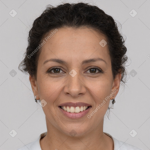 Joyful white adult female with short  brown hair and brown eyes