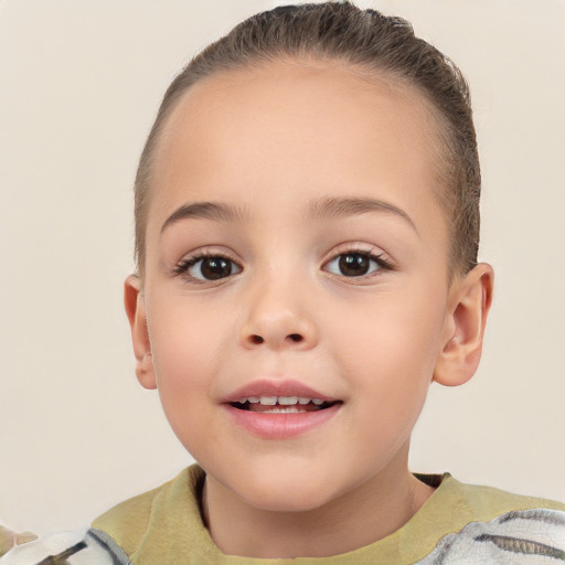 Joyful white child female with short  brown hair and brown eyes