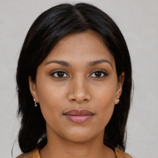 Joyful asian young-adult female with medium  brown hair and brown eyes