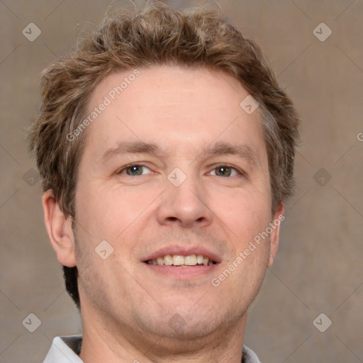 Joyful white adult male with short  brown hair and grey eyes