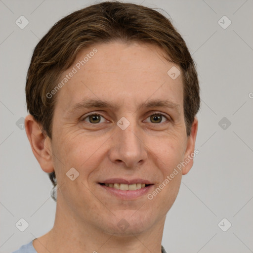 Joyful white adult male with short  brown hair and grey eyes