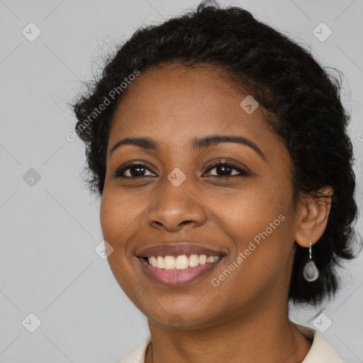 Joyful black young-adult female with medium  black hair and brown eyes