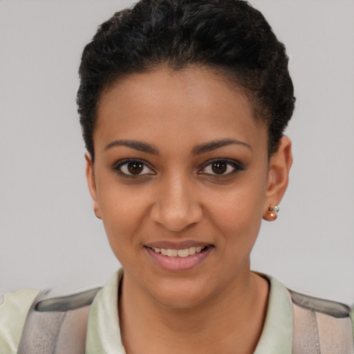 Joyful latino young-adult female with short  black hair and brown eyes