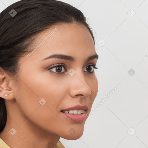 Joyful latino young-adult female with long  brown hair and brown eyes