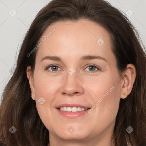 Joyful white adult female with long  brown hair and brown eyes