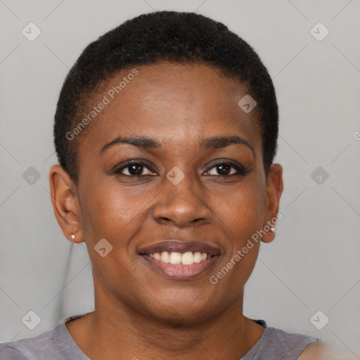 Joyful black young-adult female with short  brown hair and brown eyes