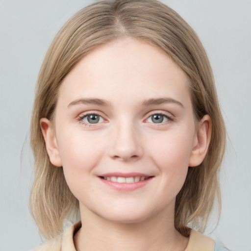 Joyful white child female with medium  brown hair and grey eyes