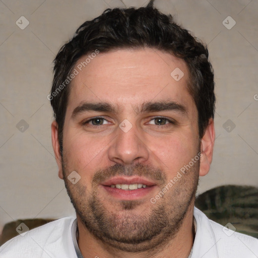 Joyful white young-adult male with short  black hair and brown eyes