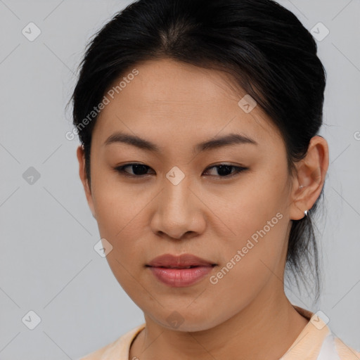 Joyful asian young-adult female with medium  brown hair and brown eyes