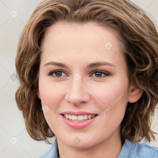 Joyful white young-adult female with medium  brown hair and blue eyes