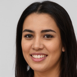 Joyful asian young-adult female with long  brown hair and brown eyes