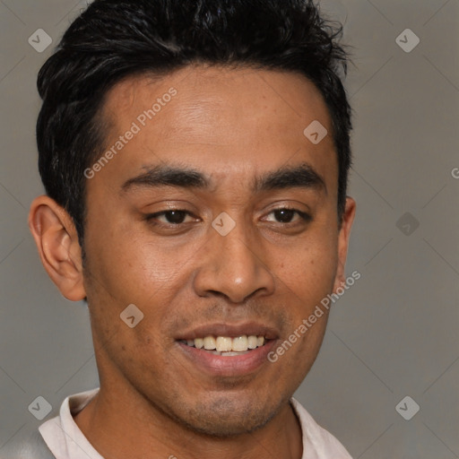Joyful latino young-adult male with short  brown hair and brown eyes