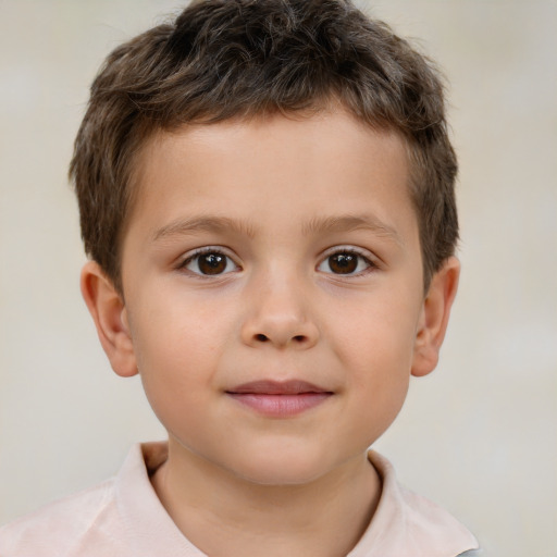 Joyful white child male with short  brown hair and brown eyes