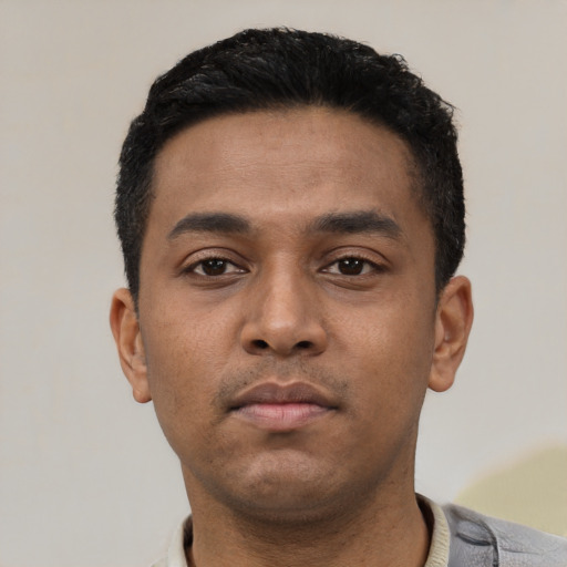 Neutral latino young-adult male with short  black hair and brown eyes