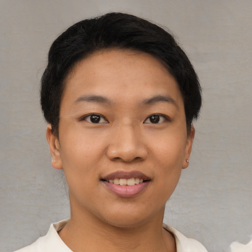 Joyful asian young-adult female with short  black hair and brown eyes