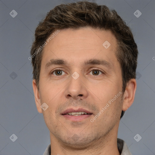 Joyful white adult male with short  brown hair and brown eyes