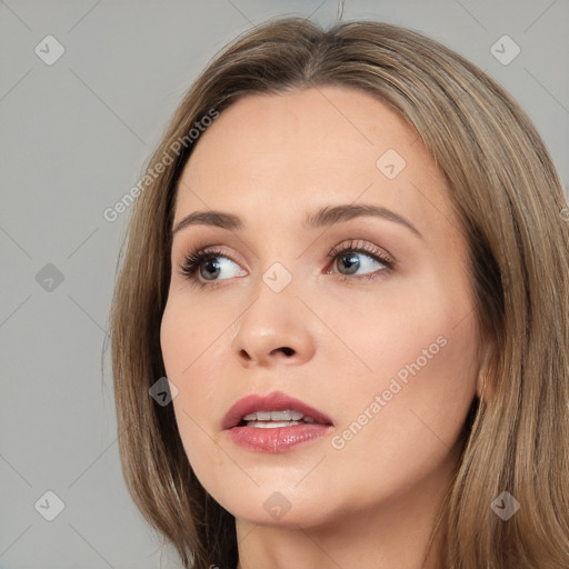 Neutral white young-adult female with long  brown hair and brown eyes