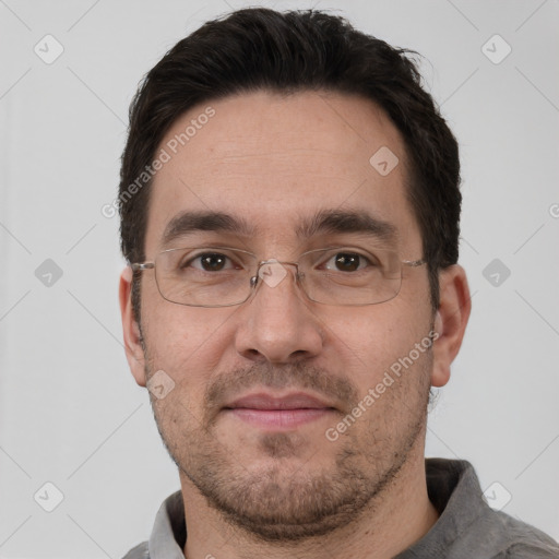 Joyful white adult male with short  brown hair and brown eyes