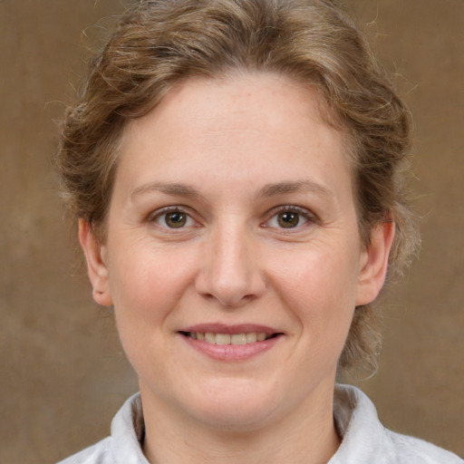 Joyful white adult female with short  brown hair and brown eyes