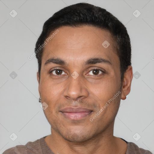 Joyful latino adult male with short  black hair and brown eyes