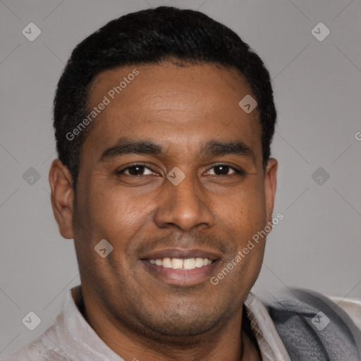 Joyful latino young-adult male with short  black hair and brown eyes