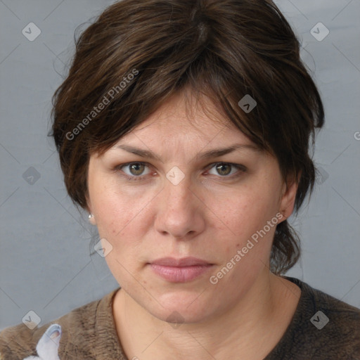 Joyful white adult female with medium  brown hair and grey eyes