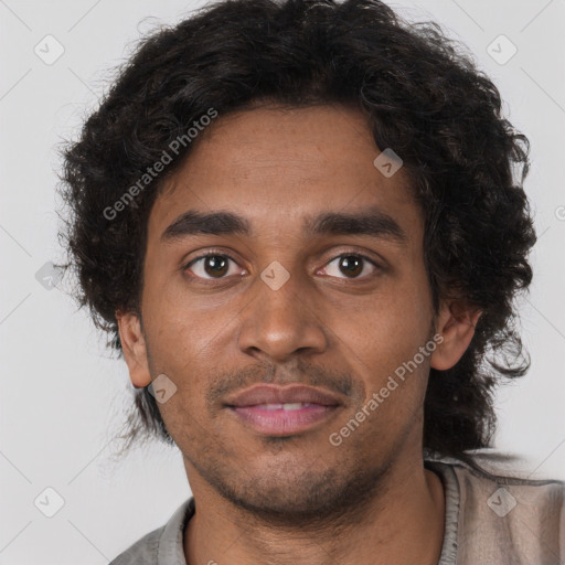 Joyful black young-adult male with short  brown hair and brown eyes