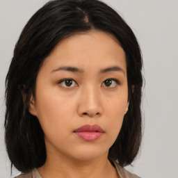 Neutral asian young-adult female with medium  brown hair and brown eyes