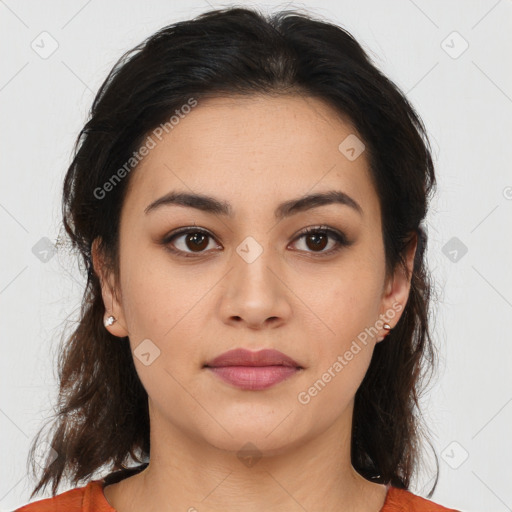 Joyful latino young-adult female with medium  brown hair and brown eyes