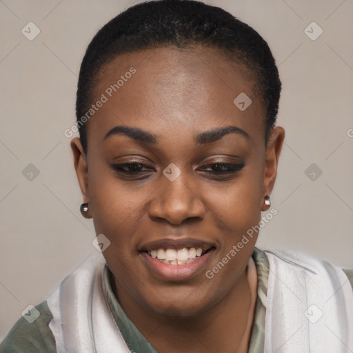 Joyful black young-adult female with short  black hair and brown eyes