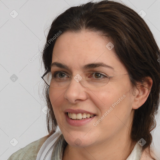 Joyful white adult female with medium  brown hair and brown eyes