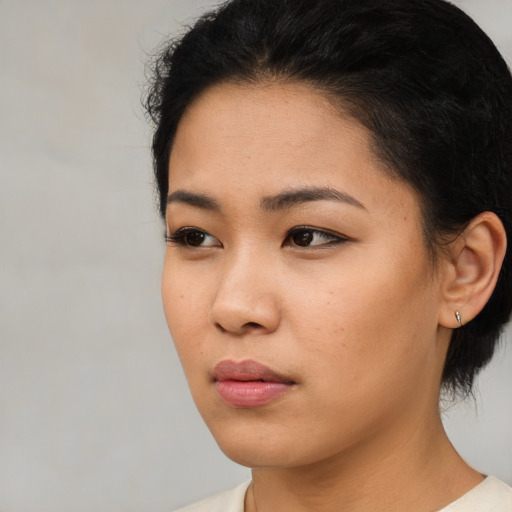 Neutral asian young-adult female with short  black hair and brown eyes