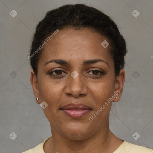 Joyful black adult female with short  brown hair and brown eyes
