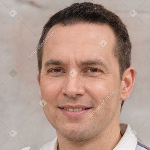 Joyful white adult male with short  brown hair and brown eyes