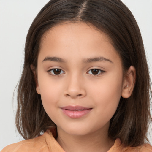 Joyful white child female with medium  brown hair and brown eyes