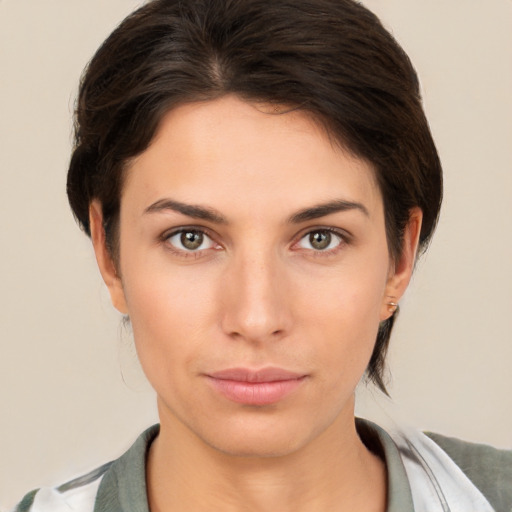 Neutral white young-adult female with short  brown hair and brown eyes