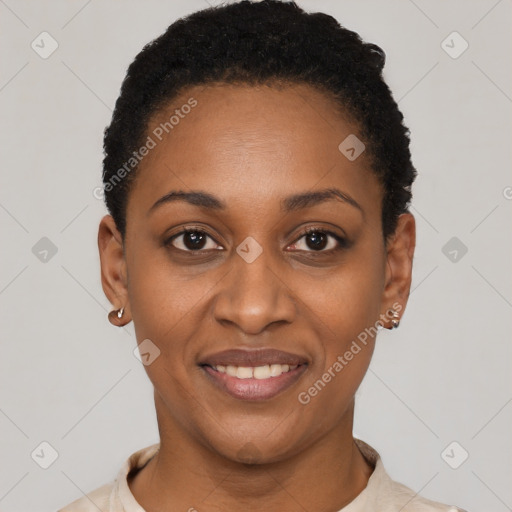 Joyful black young-adult female with short  black hair and brown eyes