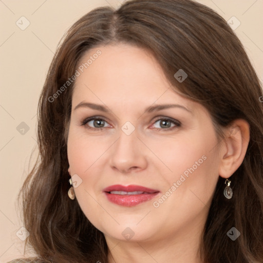 Joyful white adult female with long  brown hair and brown eyes