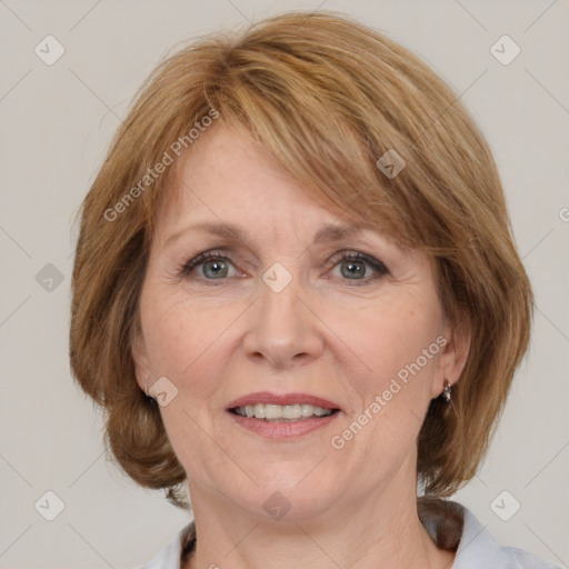 Joyful white adult female with medium  brown hair and grey eyes