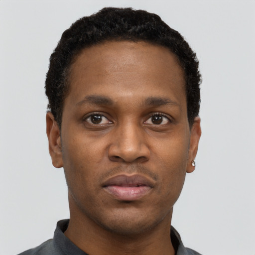 Neutral black young-adult male with short  black hair and brown eyes