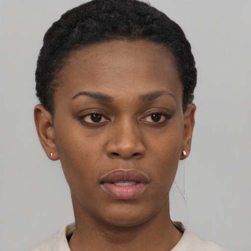 Neutral black young-adult female with short  black hair and brown eyes