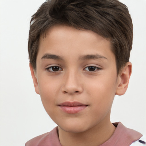 Joyful white child male with short  brown hair and brown eyes