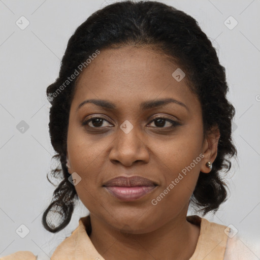 Joyful black adult female with medium  brown hair and brown eyes