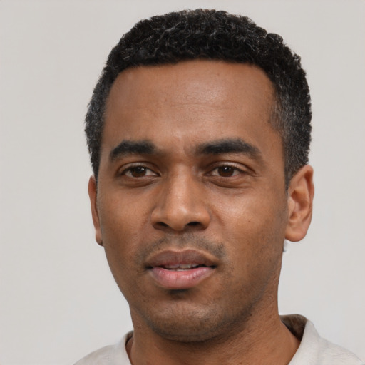 Neutral black young-adult male with short  black hair and brown eyes