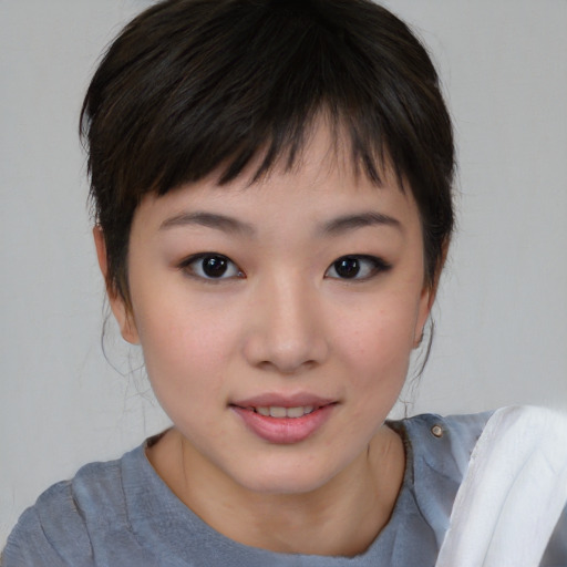Joyful asian child female with medium  brown hair and brown eyes