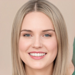 Joyful white young-adult female with long  brown hair and green eyes